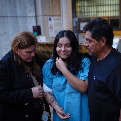 Marimar Martinez, center, is greeted by her family after being released from the Metropolitan Correctional Center on Oct. 6, 2025, after being shot by immigration agents and charged with assaulting federal officers in an incident in Chicago's Brighton Park. (E. Jason Wambsgans/Chicago Tribune via AP)