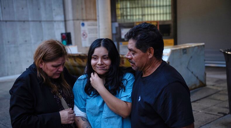 Marimar Martinez, center, is greeted by her family after being released from the Metropolitan Correctional Center on Oct. 6, 2025, after being shot by immigration agents and charged with assaulting federal officers in an incident in Chicago's Brighton Park. (E. Jason Wambsgans/Chicago Tribune via AP)