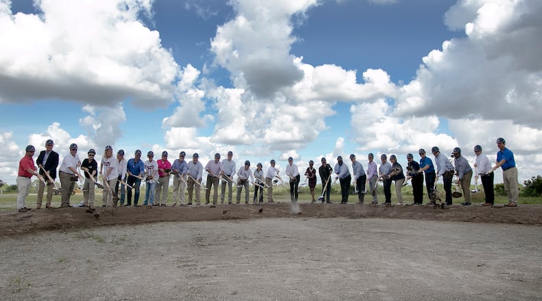 Braves executives, including chairman and CEO Terry McGuirk (near center in white shirt), joined Sarasota County, North Port and West Villages officials for Monday’s groundbreaking ceremony.