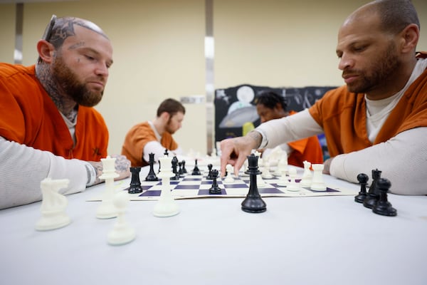 Inmates Brian Martin (left) and Donovan Mallard play a game of chess at the Athens-Clarke County Jail on Monday, June 9, 2025. Inmates take part in an 8-week program at the jail, where they participate in a conflict resolution class that uses chess as a teaching tool. (Miguel Martinez/AJC)