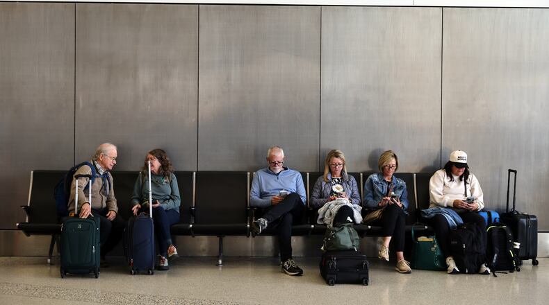 Travelers wait and check for their flights at San Francisco International Airport on Friday, Nov. 7, 2025. (Gabrielle Lurie /San Francisco Chronicle via AP)