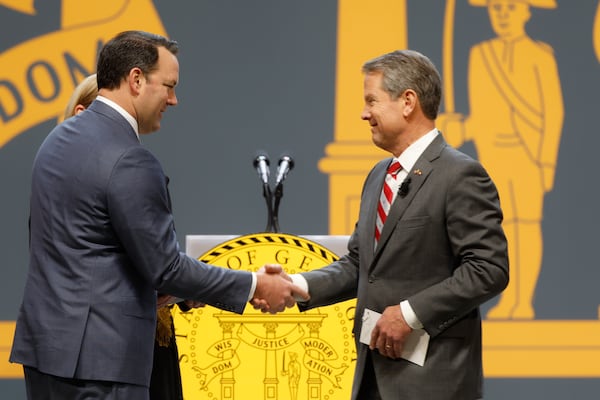 Lt. Gov. Burt Jones (left) shakes hands with Gov. Brian Kemp after being sworn into office in 2023. (Natrice Miller/AJC) 