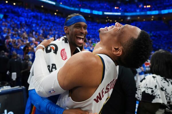 Denver Nuggets' Russell Westbrook, right, talks with Oklahoma City Thunder's Shai Gilgeous-Alexander, left, after Game 7 in the Western Conference semifinals of the NBA basketball playoffs, Sunday, May 18, 2025, in Oklahoma City. (AP Photo/Kyle Phillips)