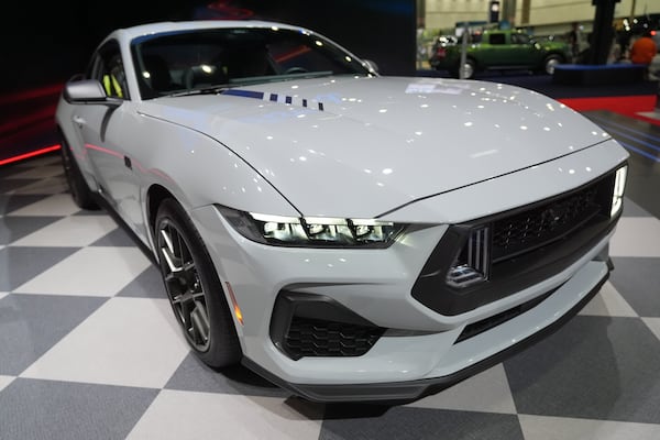 The 2026 Ford Mustang GT is revealed at the LA Auto Show in Los Angeles Thursday, Nov. 20, 2025. (AP Photo/Damian Dovarganes)