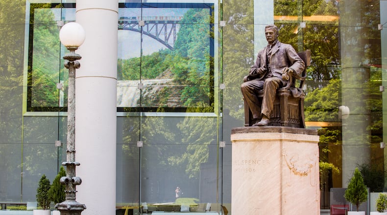 The statue of Samuel Spencer stands in front of the Norfolk Southern building on Peachtree Street on Tuesday, April 13, 2021.  The city owns the statue and Norfolk Southern is asking permission to store the confederate monument of their first president, until they decide what to do with it.  (Jenni Girtman for The Atlanta Journal-Constitution)