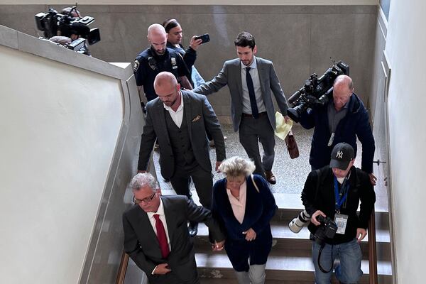 Former New York state trooper Thomas Mascia, center left, leaves Nassau County court in Mineola, N.Y. on Wednesday, May 21, 2025, after pleading guilty to charges that he shot himself and lied about it. (AP Photo/Philip Marcelo)