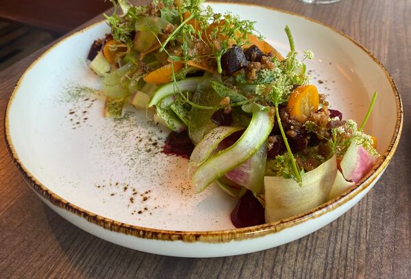 At Auburn Angel, fresh produce is given exacting care, as with a little gem salad combining pickled kumquats, watermelon radish, star fruit, beets and umbrellas of chervil. (Ligaya Figueras/lfigueras@ajc.com)