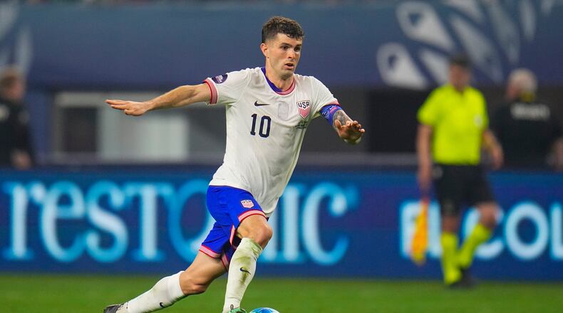 FILE - United States' Christian Pulisic dribbles during a CONCACAF Nations League championship soccer match between Mexico and the United States, Sunday, March 24, 2024, in Arlington, Texas. (AP Photo/Julio Cortez, File)