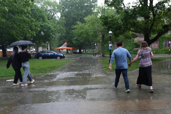 David Kim, a Catholic altar server, and his girlfriend, Savannah Nichols, walk on the Princeton University campus after attending a Mass at the school's chapel in Princeton, N.J., on Friday, May 16, 2025. (AP Photo/Luis Andres Henao)