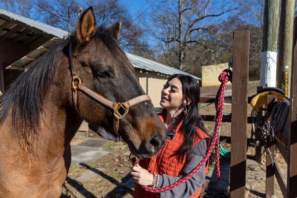 A teenage resident participates in equine therapy at Murphy-Harpst Children's Center in Cedartown in 2024. (Arvin Temkar/AJC)