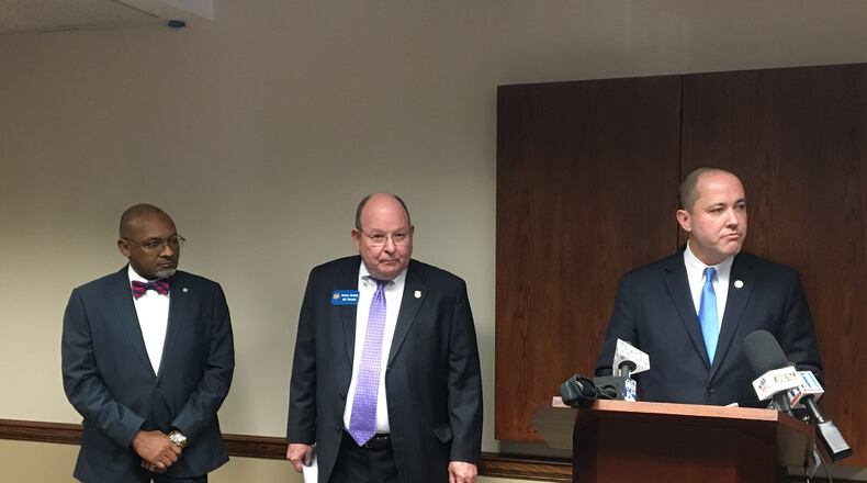 Dougherty County District Attorney Greg Edwards, GBI Director Vernon Keenan and Georgia Attorney General Chris Carr announce the arrests of three people Monday who allegedly took Medicaid funding from the elderly and housed them in poor conditions. MARK NIESSE/ MARK.NIESSE@AJC.COM