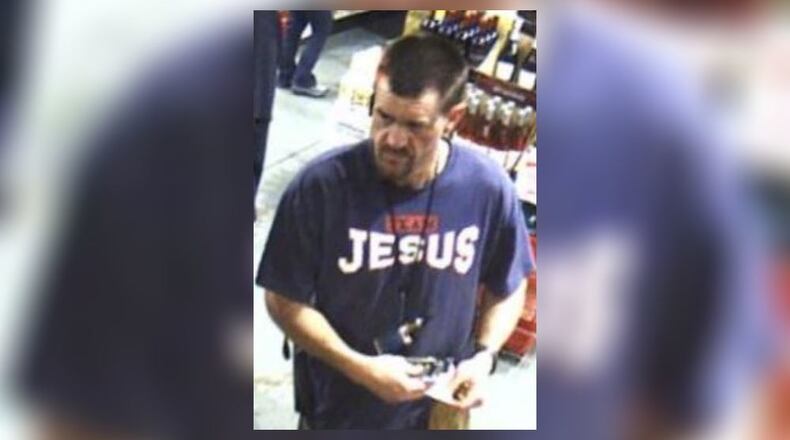 A man was arrested for shooting out a window of a police car in Henry County.