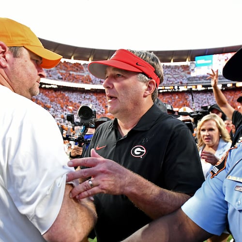 Georgia coach Kirby Smart and Tennessee coach Josh Heupel shake hands after the Bulldogs won in overtime at Neyland Stadium on Saturday, Sept. 13, 2025, in Knoxville, Tenn. (Hyosub Shin/AJC)