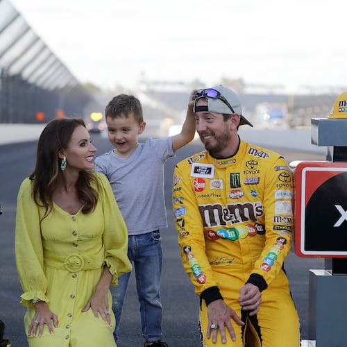 FILE - NASCAR Xfinity Series driver Kyle Busch celebrates with his wife, Samantha, and son, Brexton, after winning the NASCAR Xfinity auto race at the Indianapolis Motor Speedway, Sept. 7, 2019 in Indianapolis. (AP Photo/Darron Cummings, File)