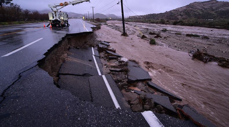 Part of California State Route 138 washes away from flooding Wednesday, Dec. 24, 2025, outside of Wrightwood, Calif. (AP Photo/Wally Skalij)
