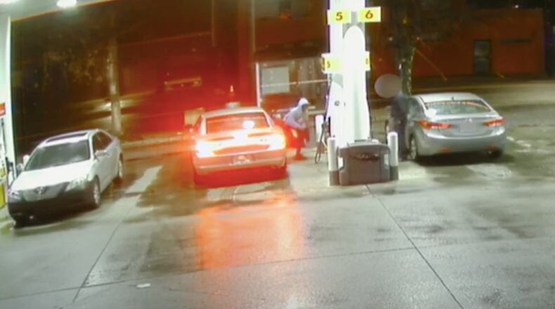 The suspect, clad in a light blue hoodie, can be seen in the video getting out of a silver muscle car and approaching the victim with a gun.