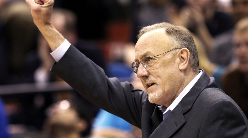 FILE - Minnesota Timberwolves head coach Rick Adelman celebrates a defensive rebound by Ricky Rubio in the second half of an NBA basketball game against Oklahoma City Thunder, March 29, 2013 ,in Minneapolis. (AP Photo/Jim Mone, File)