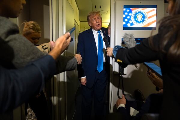 President Donald Trump speaks with reporters while flying aboard Air Force One en route from Calgary, Canada to Joint Base Andrews, Md., late Monday, June 16, 2025. (AP Photo/Mark Schiefelbein)