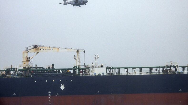 In this handout photo provided by the French Army, an NH90 helicopter intercepts an oil tanker that was traveling from Russia under international sanctions, on the Atlantic Sea, Sunday, May 31, 2026. (French Army via AP)