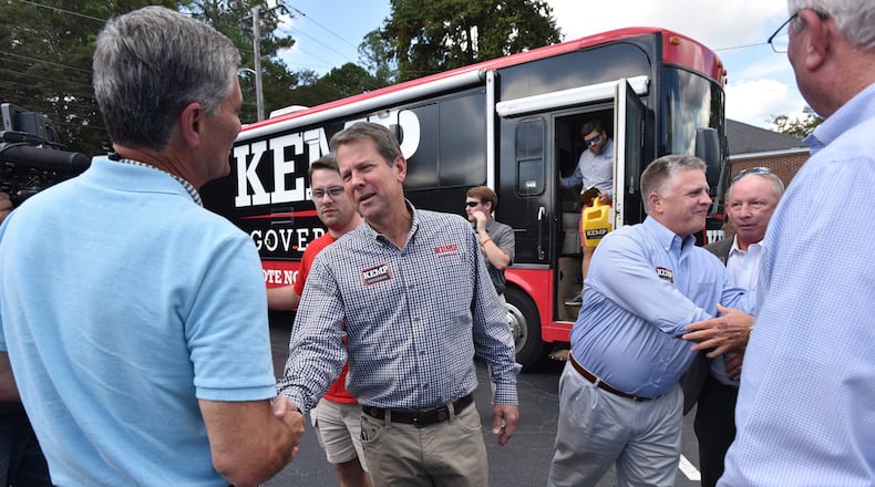 Republican gubernatorial candidate Brian Kemp greets supporters earlier this month during a bus stop tour at Sprayberry’s BBQ in Newnan. HYOSUB SHIN / HSHIN@AJC.COM