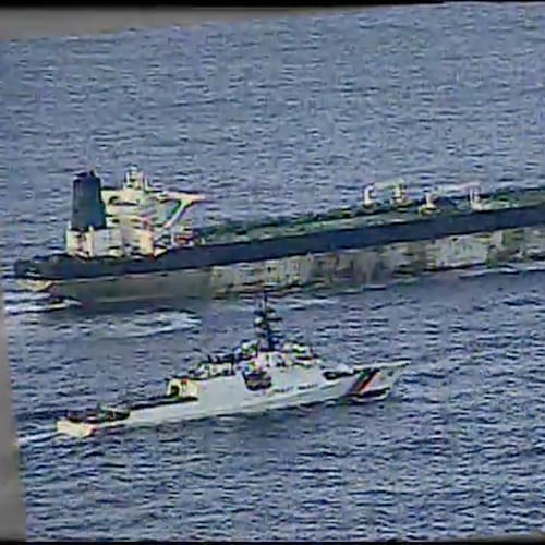 This image from video provided by the U.S. Department of Defense, shows the U.S. Coast Guard cutter Munro shadowing the MV Bella 1 in the North Atlantic Ocean during the maritime interdiction operation Wednesday, Jan. 7, 2026. (Department of Defense via AP)