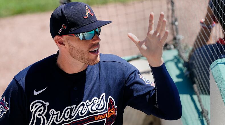 Atlanta Braves first baseman Freddie Freeman (5) waves to fans as he exits the final spring training game Tuesday, March 30, 2021, against the Boston Red Sox in Fort Myers, Fla. (John Bazemore/AP)