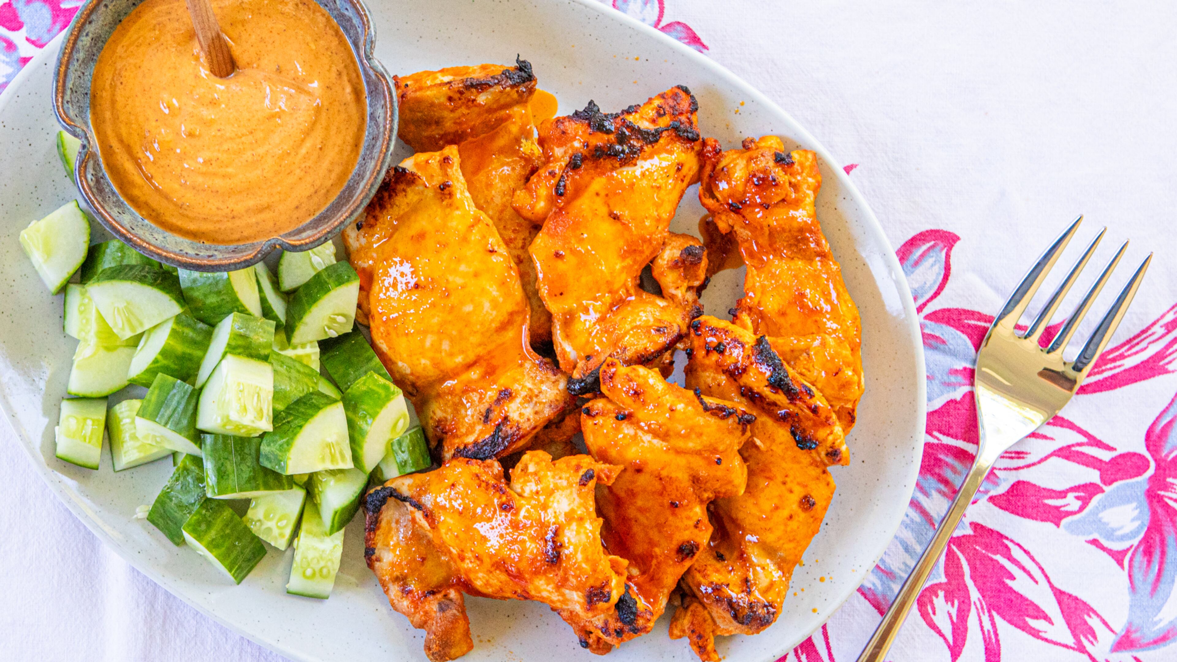 Satay-style chicken thighs use the broiler instead of the grill. (Aaliyah Man for the AJC)