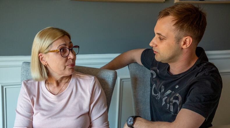 Igor Lutsenko sits in his Lawrenceville home with his mother, Lyudmila Soloshenko, Friday, March 4, 2022. STEVE SCHAEFER FOR THE ATLANTA JOURNAL-CONSTITUTION