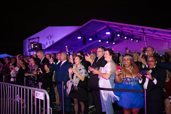 Delta Air Lines celebrates its 100-year anniversary on Saturday, March 15, 2025, at the Delta Flight Museum. More than 1,200 people were expected to attend. After formal remarks, the crowd went outside for the unveiling of a new plane livery. (Jenni Girtman for The Atlanta Journal-Constitution)