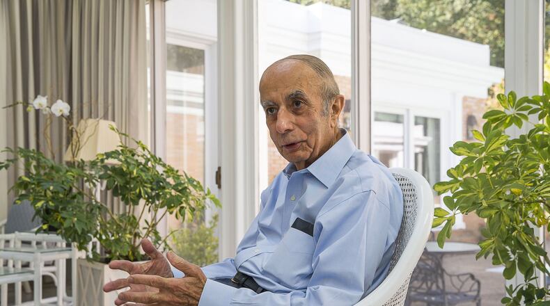 Shouky Shaheen, 90, still goes to the office at Shaheen & Co. most days, though he says he retired two years ago. “It’s easier to do things there,” he said. “You’ve seen my desk at home. It’s too crowded.” (Alyssa Pointer/Atlanta Journal Constitution)