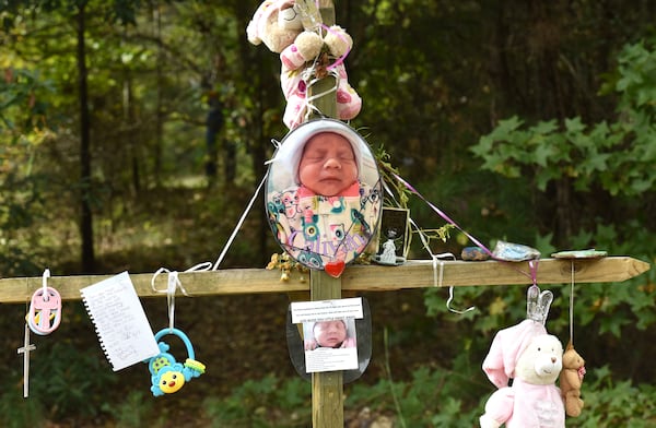October 13, 2017 Covington - A memorial of flowers and letters is near the area where thebody of two-week old Caliyah was found in Covington on Friday, October 13, 2017. HYOSUB SHIN / HSHIN@AJC.COM