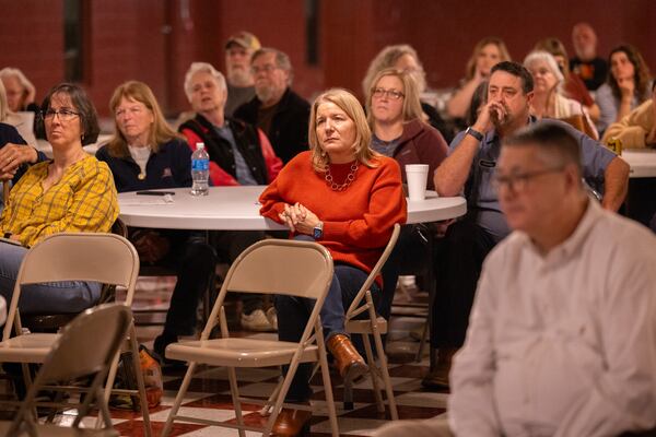 Attendees listen to plans to oppose a potential ICE detention facility that could be built in Social Circle on Tuesday, Jan. 6, 2026. About 75 people attended the event, organized by One Circle Community Coalition, at a community hall in the city. (Arvin Temkar/AJC)