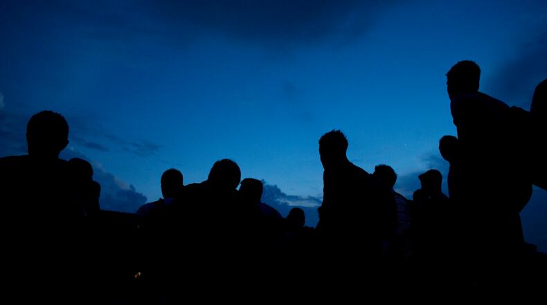 In this June 19, 2014 photo, a Central American migrants emerge from side streets to crowd onto the tracks, as a northbound freight train arrives in the station in Arriaga, Chiapas state, Mexico. Tens of thousands of unaccompanied children have been apprehended crossing the U.S. Mexico border since October. Three-fourths of them are from Honduras, Guatemala and El Salvador and most say they are fleeing pervasive gang violence and crushing poverty. (AP Photo/Rebecca Blackwell) In this June 19 photo, Central American migrants emerge from side streets to crowd onto the tracks, as a northbound freight train arrives in the station in Arriaga, Chiapas state, Mexico. Tens of thousands of unaccompanied children have been apprehended crossing the U.S. Mexico border since October. Three-fourths of them are from Honduras, Guatemala and El Salvador and most say they are fleeing pervasive gang violence and crushing poverty. AP/Rebecca Blackwell