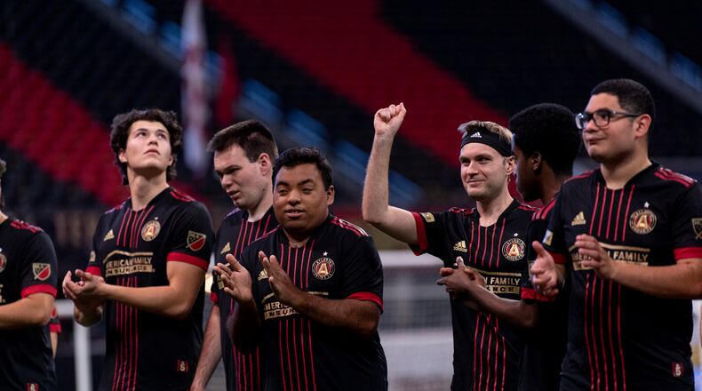 Brendan Jagielski raises his arm in victory in Images from the Atlanta United Unified team match against the Inter Miami Unified team at Mercedes-Benz Stadium in October. (Photo by Dakota Williams /Atlanta United)
