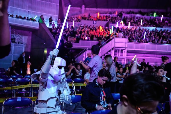 Fans react to the opening act during the Star Wars Celebration in Chiba, near Tokyo, Friday, April 18, 2025. (AP Photo/Hiro Komae)