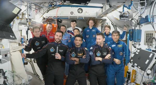 This photo provided by Axiom Space shows the private crew of four, in dark suits, from left, Axiom mission commander Peggy Whitson, Hungary's Tibor Kapu, India's Shubhanshu Shukla and Poland's Slawosz Uznanski-Wisniewski, during a farewell ceremony aboard the International Space Station on Sunday, July 13, 2025. (Axiom Space via AP)