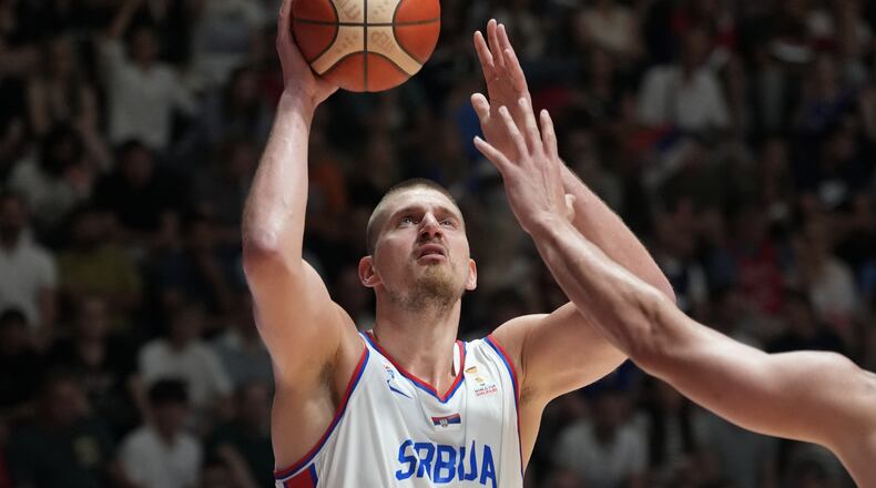 Serbia's Nikola Jokic tries to score as Bosnia's Luka Garza blocks him during their FIBA Basketball World Cup 2027 European qualifiers match between Serbia and Bosnia, in Belgrade, Serbia, Monday, July 6, 2026. (AP Photo/Darko Vojinovic)