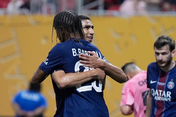 Paris Saint-Germain's Achraf Hakimi celebrates his goal with Paris Saint-Germain's Bradley Barcola during the Club World Cup round of 16 soccer match between PSG and Inter Miami in Atlanta, Sunday, June 29, 2025. (AP Photo/Mike Stewart)