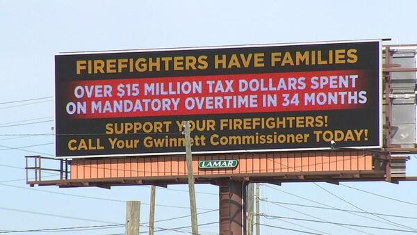 A billboard protesting ‘mandatory overtime’ at the Gwinnett County fire department has gone up near Ga. 20 and Ga. 316 in Lawrenceville. WSB RADIO