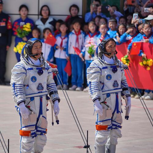FILE - Chinese astronaut for the Shenzhou 20 mission, Chen Dong, center, speaks next to his comrades Chen Zhongrui, right, and Wang Jie as they attend a send-off ceremony for their manned space mission at the Jiuquan Satellite Launch Center in northwestern China, Thursday, April 24, 2025. (AP Photo/Andy Wong, file)