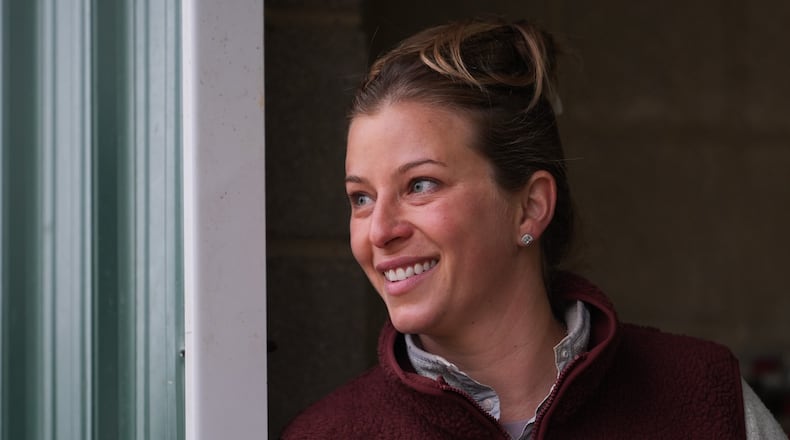 Trainer Brittany Russell talks to people in her barn ahead of the 102nd running of the Black-Eyed Susan horse race, Friday, May 15, 2026, at Laurel Park in Laurel, Md. (AP Photo/Julia Demaree Nikhinson)