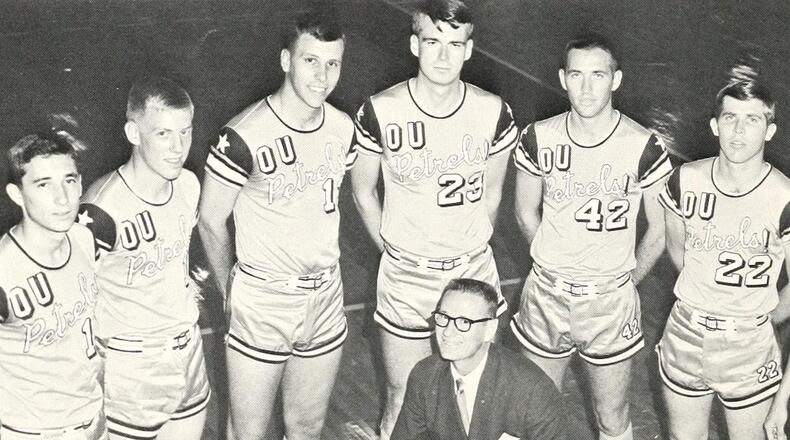 Coach Garland Pinholster with one of his basketball teams at Oglethorpe University.