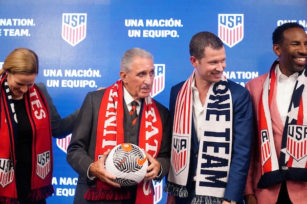 U.S. Soccer President Cindy Parlow Cone (left), Atlanta business icon and philanthropist Arthur Blank (second from left), JT Batson, U.S. Soccer CEO (second from right), and Georgia Mayor Andre Dickens (right) pose for a portrait after a news conference, Saturday, Sept. 16, 2023, in Atlanta. (Brynn Anderson/AP File)