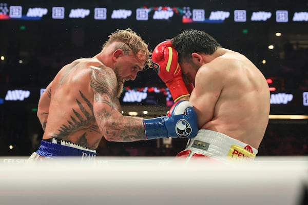 Jake Paul, left, punches Julio Cesar Chavez Jr. during their cruiserweight boxing match on Saturday, June 28, 2025, in Anaheim, Calif. (AP Photo/Etienne Laurent)