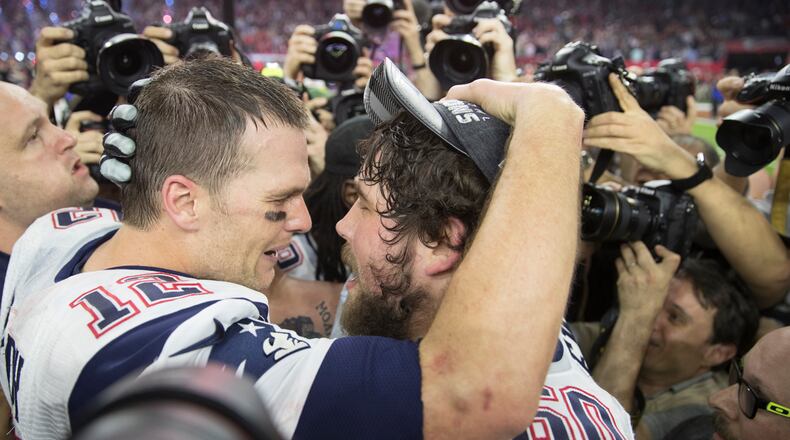 New England Patriots quarterback Tom Brady shares a moment with his teammate David Andrews after beating the Atalnta Falcons 34-28 on Sunday, Feb. 5 , 2017 during the NFL Super Bowl LI football game at the NRG Stadium in Houston, Texas.