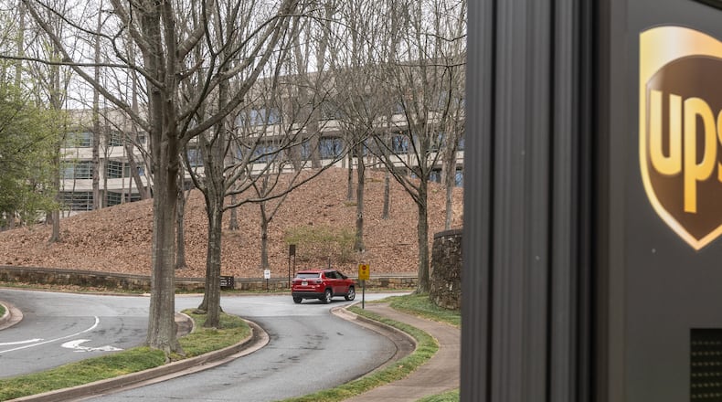 Cars arrive at 55 Glenlake Parkway NE, in Sandy Springs where office workers at UPS streamed back into work on Monday, March, 4, 2024 the first day a new policy requiring them to come into work in person five days a week took effect. The new policy, announced in January, (John Spink / John.Spink@ajc.com)