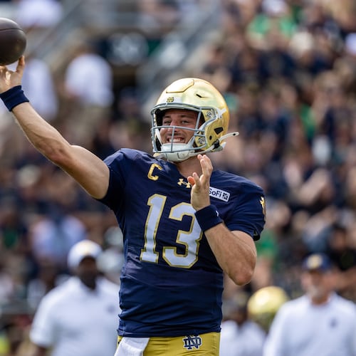 Notre Dame quarterback CJ Carr (13) throws before an NCAA college football game against Rice, Saturday, Sept. 12, 2026, in South Bend, Ind. (AP Photo/Paul Barnick)