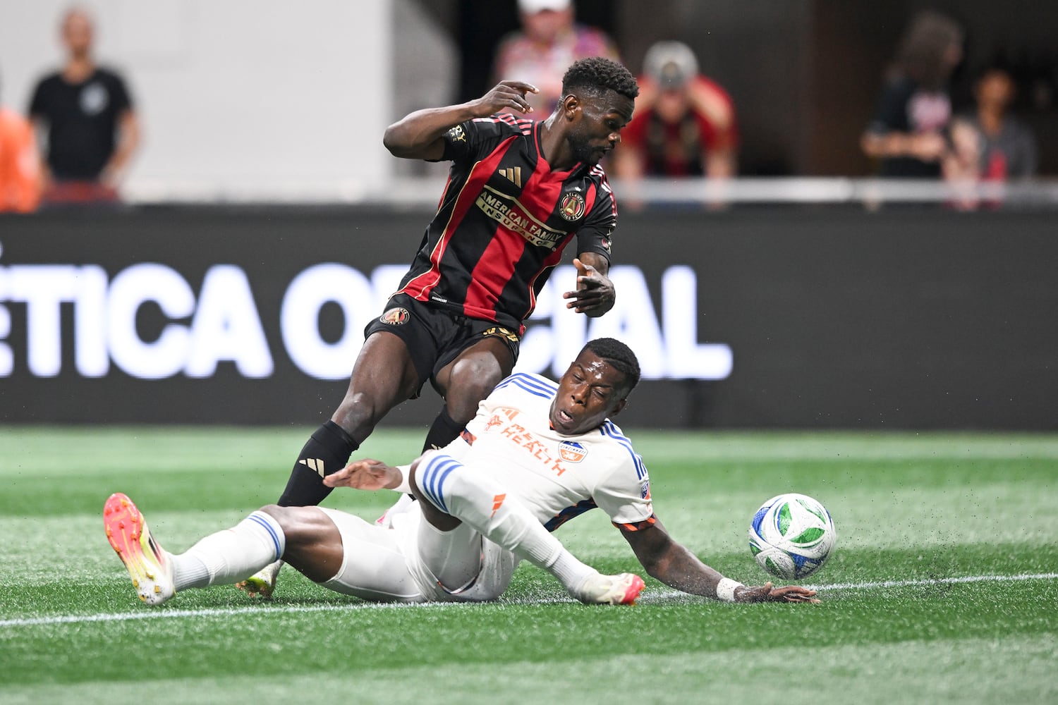 Atlanta United forward Emmanuel Latte Lath (19) and FC Cincinnati defender Teenage Hadebe (16) collide as the fight for possession of the ball during the first half of a MLS soccer game Sunday, May 25, 2025 at the Mercedes-Benz Stadium. (Daniel Varnado/For the Atlanta Journal-Constitution)