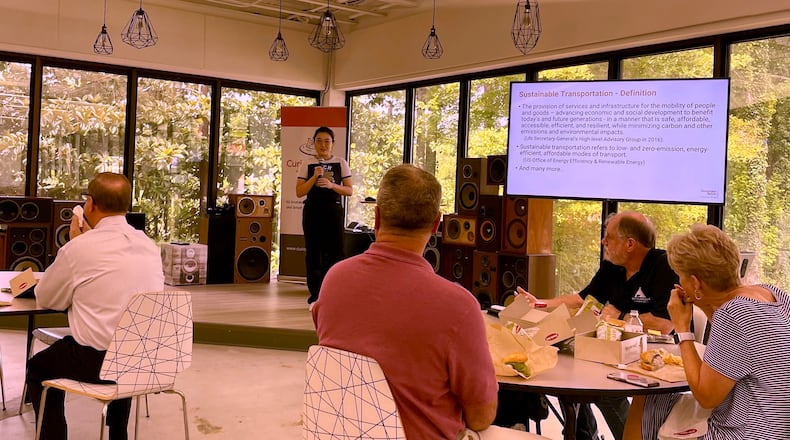 Georgia Tech student, Jun Wang, leads a discussion on sustainable travel at the Curiosity Lab in Peachtree Corners. (Photo by Karen Huppertz for the AJC)