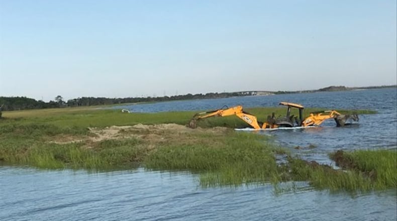 Three of the four vehicles are still stuck on the north end of Tybee Island in an area under the jurisdiction of the Georgia Coastal Marshlands Protection Act, according to officials.